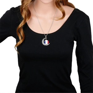 Silver crescent moon necklace with French flag glass cabochon pendant on a model