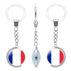 Rotating keychain showing French flag and world map detail on polished silver metal