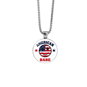 Detail showing round pendant with American flag smiley face on silver box chain necklace