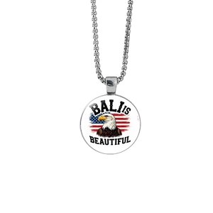 Silver crescent moon necklace with American flag and eagle pendant on a white background