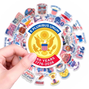 Macro shot of waterproof American 250th anniversary stickers with US flag and eagle designs