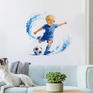Detail of a boy playing soccer wall decal above a blue sofa in a clean living room