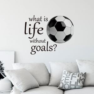 Soccer wall decal with 'What is life without goals?' text over a modern white sofa
