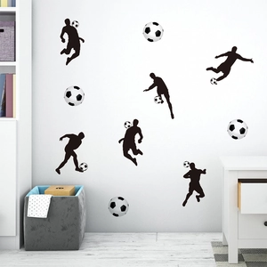 Soccer wall decals featuring black athlete silhouettes and footballs in a modern white room