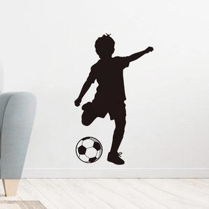 Detail of soccer silhouette wall sticker applied to a white wall in a modern room