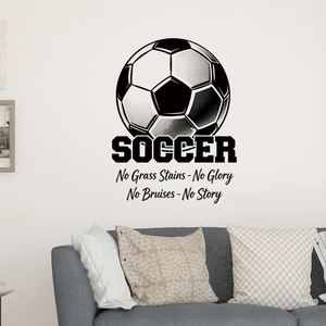 Inspirational soccer wall decal with quotes on a wall above a modern grey fabric sofa
