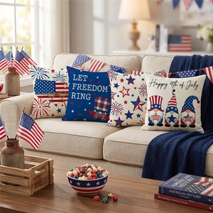 Set of 4 Independence Day pillow covers with 4th of July gnomes and flag on a sofa