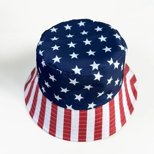 Top view of USA flag pattern bucket hat with stars and red stripes on white background