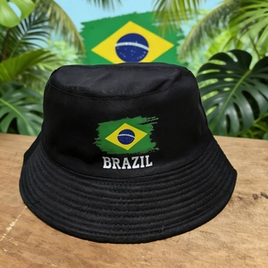Unisex black Brazil flag bucket hat for sun protection with tropical leaf background
