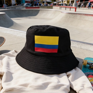 Black foldable Colombia flag bucket hat for men and women on casual light beige sweatshirt