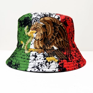 Macro detail of Mexico flag bucket hat with eagle crest and black ink splash texture