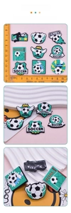 Detailed macro view of soccer themed PVC soft glue charms for DIY accessory projects