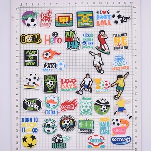 Soccer themed PVC shoe charms for clogs, assorted football and player designs on grid