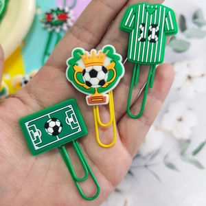 Set of football themed PVC paper clips featuring jersey, trophy and pitch designs