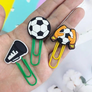 Creative soccer themed paper clips set with ball and goal charms held in hand