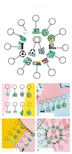 Detail view of various PVC football keychains featuring soccer balls, shoes, and trophies