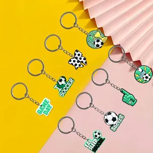 Set of 8 soccer themed PVC soft rubber keychains with various creative cartoon patterns