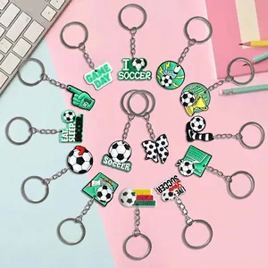 Creative soccer themed PVC keychain set featuring diverse football jersey and trophy designs