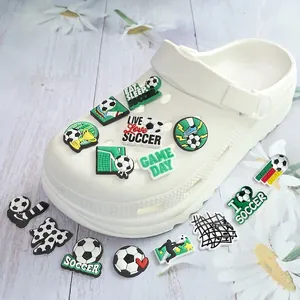 Soccer themed PVC shoe charms set featuring footballs and trophies on white clogs
