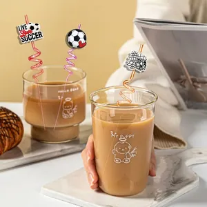 Soccer-themed spiral PETG straws set with PVC charms shown in a cold drink glass