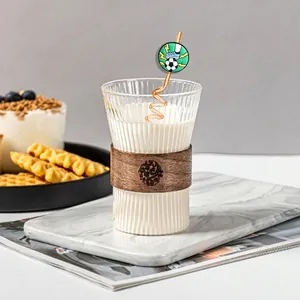 Soccer ball and sports shoe motif on spiral straw for World Cup themed drinkware