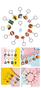 Collection of sports themed PVC keychains featuring soccer, basketball and baseball gear