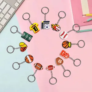 Set of 12 sports themed PVC keychains featuring basketball and football on a colorful background