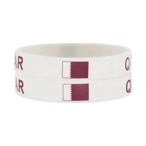 Close-up of dual white silicone Qatar national flag sport wristbands with red printing