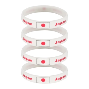 Set of four white silicone sports wristbands with Japan flag and text for fans