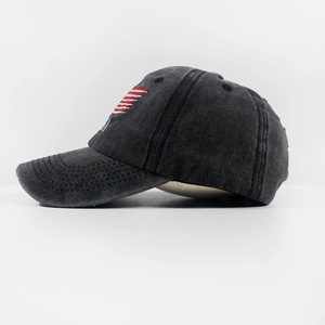 Side view detail of vintage washed black baseball cap with red and white striped embroidery