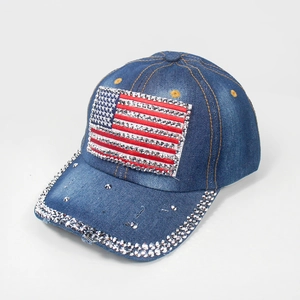Macro detail of rhinestone-studded American flag pattern on denim blue baseball cap