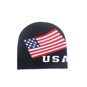 Black knit beanie hat featuring USA lettering and American flag pattern for winter sports