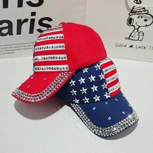 Detail of USA flag baseball caps featuring sparkling rhinestones and star embroidery