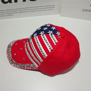 Detail of USA flag baseball cap with shimmering rhinestones and red stripes
