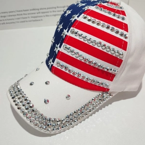 Detail of silver rhinestones hand-set on an American flag pattern baseball cap