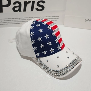 Detail of American flag pattern on white baseball cap with sparkling silver rhinestones