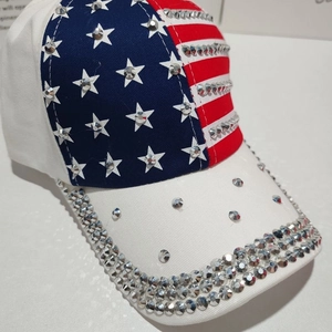 Detailed view of American flag baseball cap with hand-applied sparkling silver rhinestones