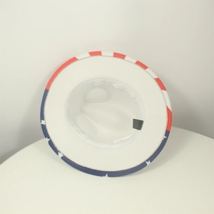 White cowboy hat with American flag pattern on brim shown from an interior perspective