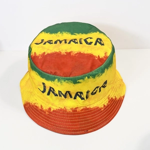 Top-down view of Jamaica bucket hat with red yellow and green stripes and canvas texture