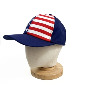 Detail of USA flag baseball cap on a mannequin head with red and white stripes and stars