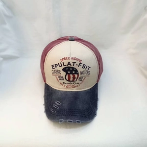 Vintage washed baseball cap with distressed American flag and biker prints on white cloth