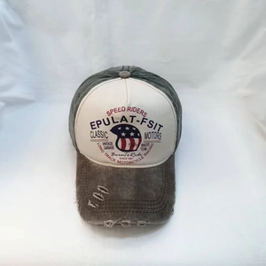 Close-up of vintage Speed Riders baseball cap with distressed brim and eagle print
