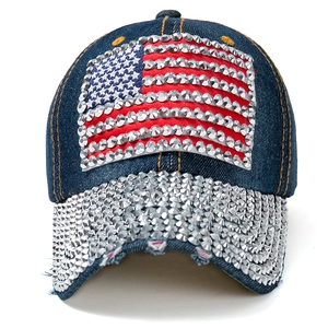 Denim baseball cap featuring rhinestone USA flag and sparkling studded brim on dark blue fabric