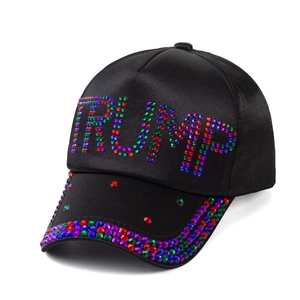 Detail of colorful rhinestones spelling TRUMP on black satin baseball cap