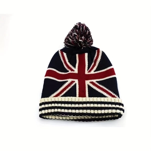 Knitted pom-pom beanie featuring a classic British Union Jack flag pattern for winter