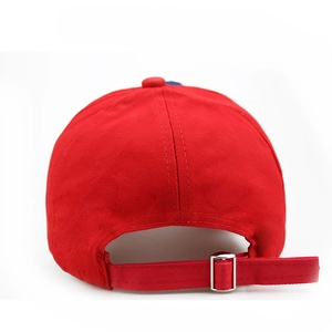 Close-up of red American flag baseball cap back showing adjustable metal strap buckle
