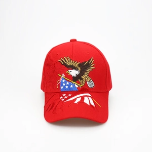 Close-up of high-density red cotton baseball cap with detailed eagle and US flag embroidery