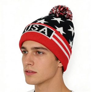 Detail of USA knit beanie featuring star jacquard pattern and red ribbed cuff