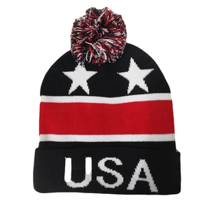 Winter knit beanie featuring USA flag patterns and stars with a mixed-color pom-pom top