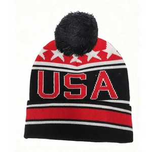 Winter USA flag knit beanie with red stars, USA text, stripes and black pom-pom